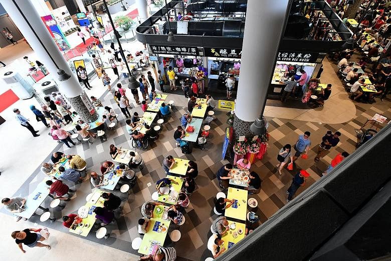 Above: The 800-seat hawker centre at Our Tampines Hub includes stalls operating 24/7. Left: The hub, located at the site of the former Tampines Stadium and Sports Hall, is expected to benefit some 200,000 residents in Tampines. Scheduled to be fully 