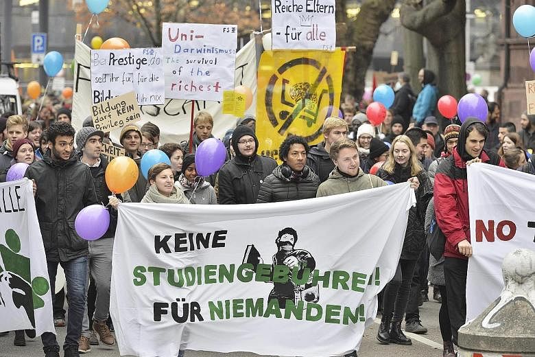 Students with a banner declaring "No study fees! For Nobody!" joining a march in the German city of Freiburg on Saturday. Several hundreds of them were protesting against the planned re-introduction of tuition fees for international students in Baden