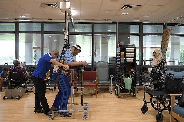 The community hospital, which was officially opened yesterday, has volunteers who tend rooftop gardens, teach patients crafts or bring books for them to read. Mr Rohaazman Ali, 47, a patient at Yishun Community Hospital, undergoing therapy after a sp