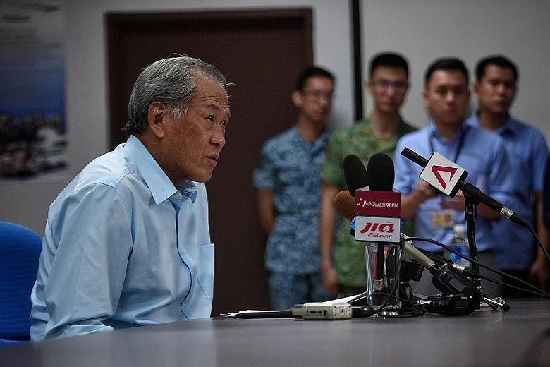 Dr Ng speaking to reporters during his visit to Choa Chu Kang military camp yesterday. Addressing the issue of the detention of SAF armoured vehicles in Hong Kong, he said the vehicles did not contain any controlled military items that would require 