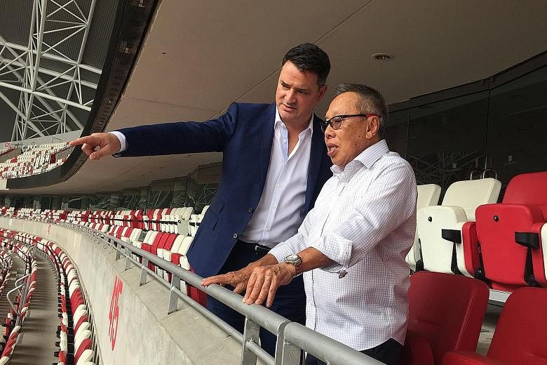 Murray Barnett, World Rugby's head of commercial, marketing and broadcast, and Singapore Rugby Union president Low Teo Ping at the National Stadium, which will host the eighth leg of the HSBC World Rugby Sevens Series next April. The tournament kicks