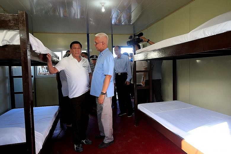Philippine President Rodrigo Duterte (far left) and Cabinet Secretary Jun Evasco inspecting the new drug treatment centre yesterday.