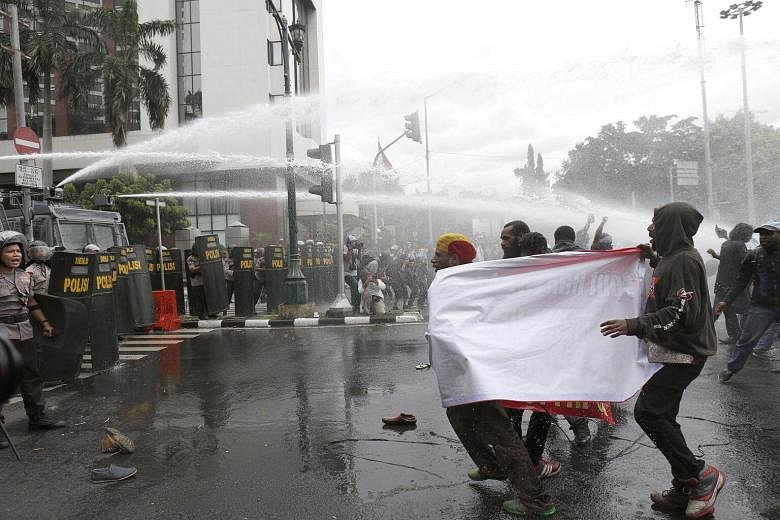 Indonesian Police Fire Water Cannon At Pro-Papua Demonstration | The ...