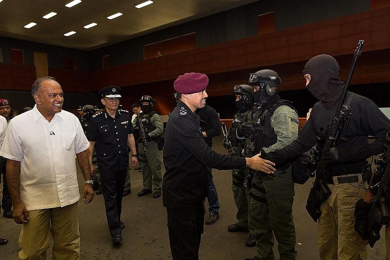 Prince Billah (in red beret) was hosted by Mr Shanmugam (far left) on his visit to the Home Team Tactical Centre in Mandai Quarry Road and witnessed counter-terrorism demonstrations.