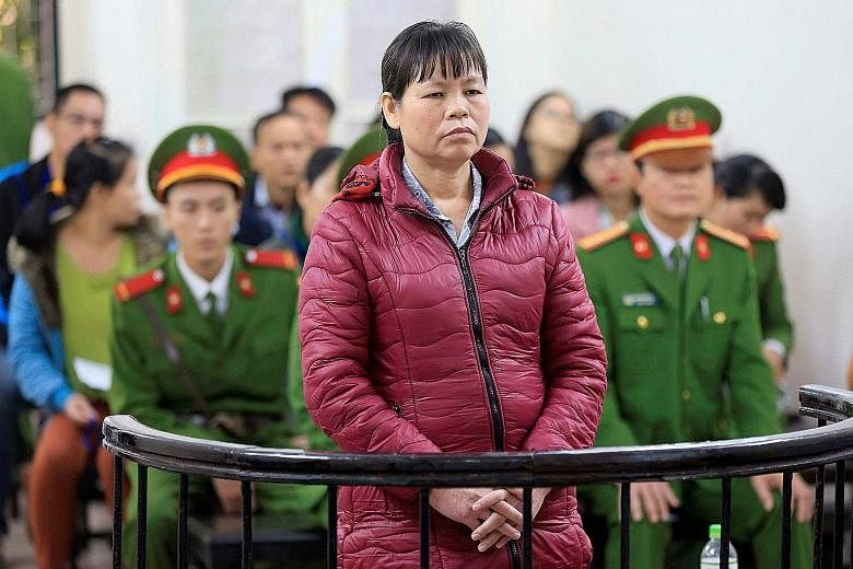 Theu, a farmer and land protection activist, standing in the dock during her appeal trial at a court in Hanoi yesterday.