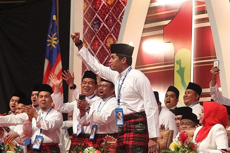 Umno Youth chief Khairy Jamaluddin urging the party to rally behind their president Najib Razak, who is Malaysia's PM. He says Mr Najib is a leader who has delivered much of the youth's aspirations.
