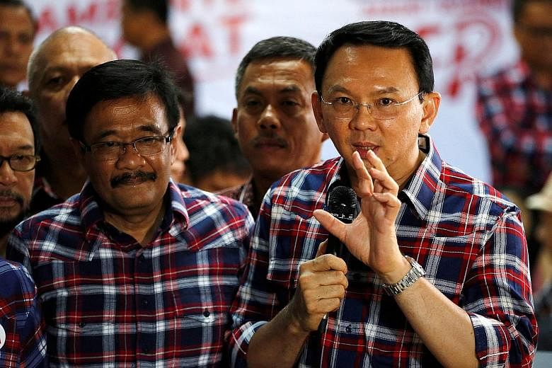 Mr Basuki (at right), with his deputy, Mr Djarot Saiful Hidayat, speaking last month to reporters about the blasphemy complaint against him. The two incumbents are defending their posts in Jakarta's gubernatorial election taking place in February.