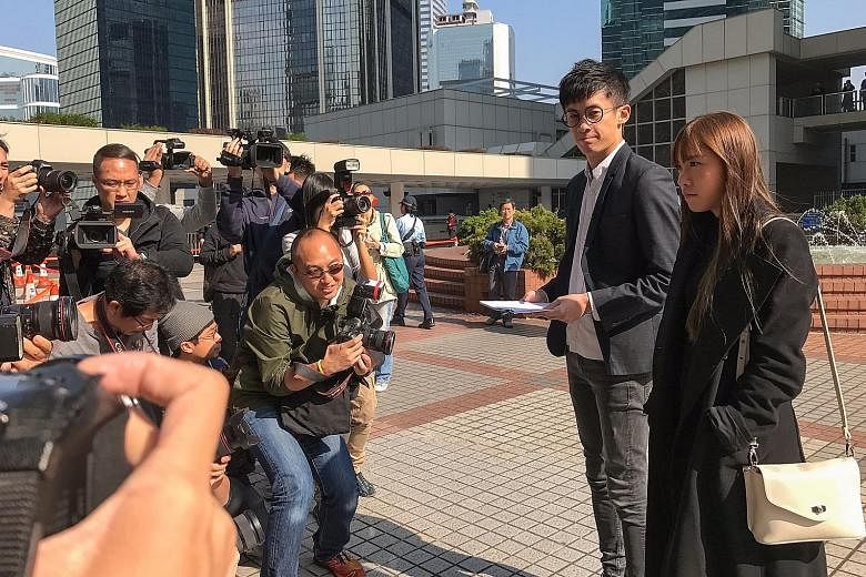 Mr Leung and Ms Yau (left) speaking to reporters yesterday after the Hong Kong Court of Appeal rejected their bid to overturn their disqualification from the Legislative Council, a fate that may now also meet Ms Lau (above).