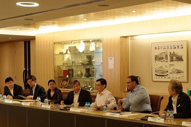 (From far left) Garena founder and chairman Forrest Li, head of civil service Peter Ong, Boston Consulting Group managing director (Singapore) Mariam Jaafar, Singapore Business Federation chairman Teo Siong Seng, Finance Minister Heng Swee Keat, Mini
