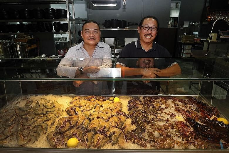 Wah Kee Big Prawn Noodle's Kevin Lau (left) is partnering Mr Andrew Tan of Japanese restaurant Tomo Izakaya to open an eatery.