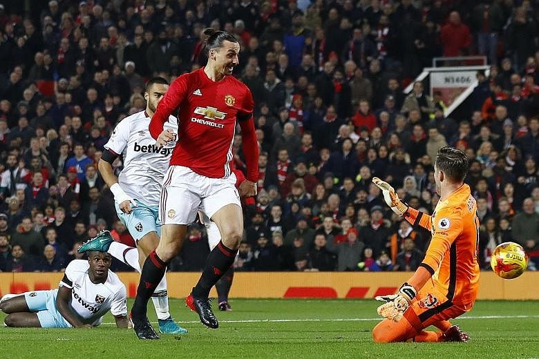 Manchester United's Zlatan Ibrahimovic scoring the opener in the League Cup quarter-final against West Ham. He had a brace, while team-mate Anthony Martial also netted twice.