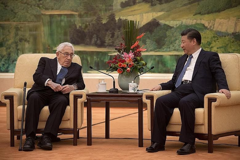 Dr Kissinger with President Xi in the Great Hall of the People in Beijing yesterday. Mr Xi told the former US secretary of state that "I am all ears to what you have to say" about the future of US-China relations.