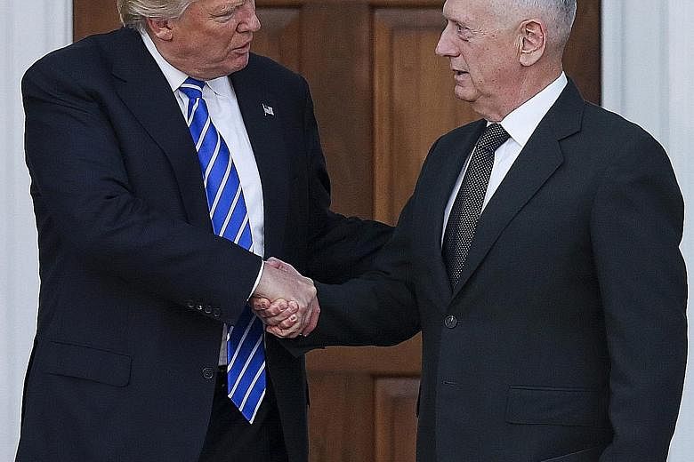Mr Trump and Gen Mattis meeting at the Trump International Golf Club in New Jersey last month. Mr Trump called him "the closest thing to (World War II-era) General George Patton that we have".