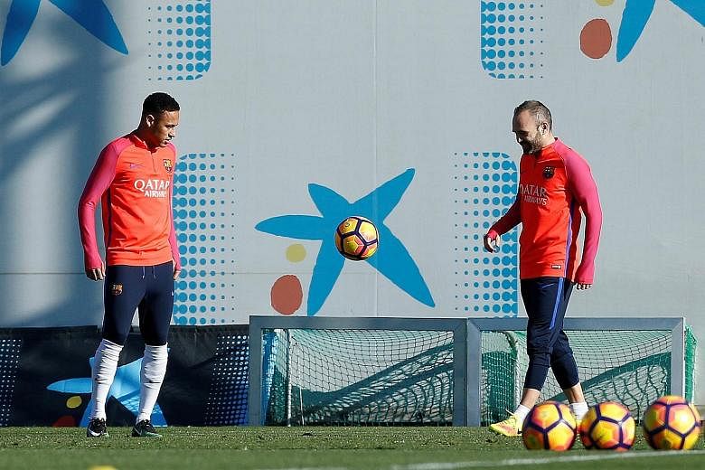Neymar (left) and Andres Iniesta training prior to today's "El Clasico" against Real at the Nou Camp. Six points behind the league leaders, the hosts cannot afford to fall further behind.