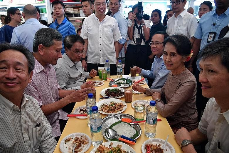 Ms Suu Kyi having breakfast yesterday with (from left) Singapore Ambassador to Myanmar Robert Chua, Dr Balakrishnan, Myanmar Union Minister for Commerce Than Myint, Myanmar Minister of State for Foreign Affairs U Kyaw Tin and National Environment Age