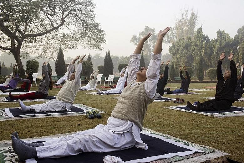 A yoga session under way in Nehru Park in New Delhi. The discipline was added to the Unesco list in recognition of its influence on Indian society.