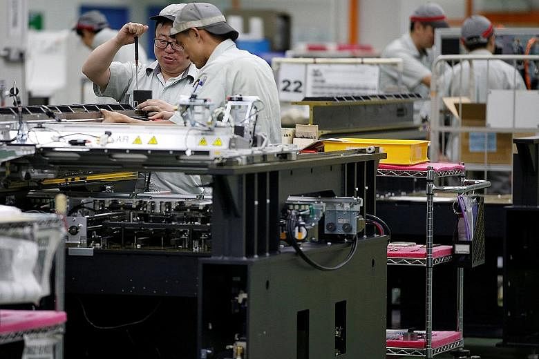 A printed circuit board assembly factory in Singapore. DBS economist Irvin Seah said the outlook for manufacturing, which makes up a fifth of Singapore's economy, is becoming more sanguine on the back of stronger US growth.