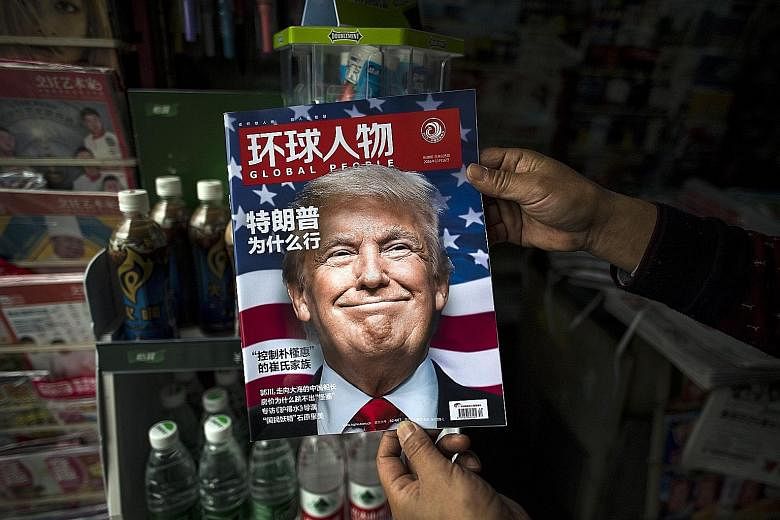 Left: Mr Trump on the cover of a local Chinese magazine after his election win last month.