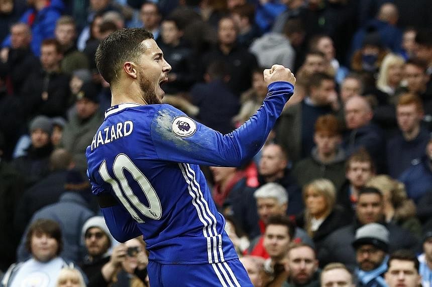 Above: Chelsea's Eden Hazard celebrating after scoring their third goal in the 3-1 victory against City.
