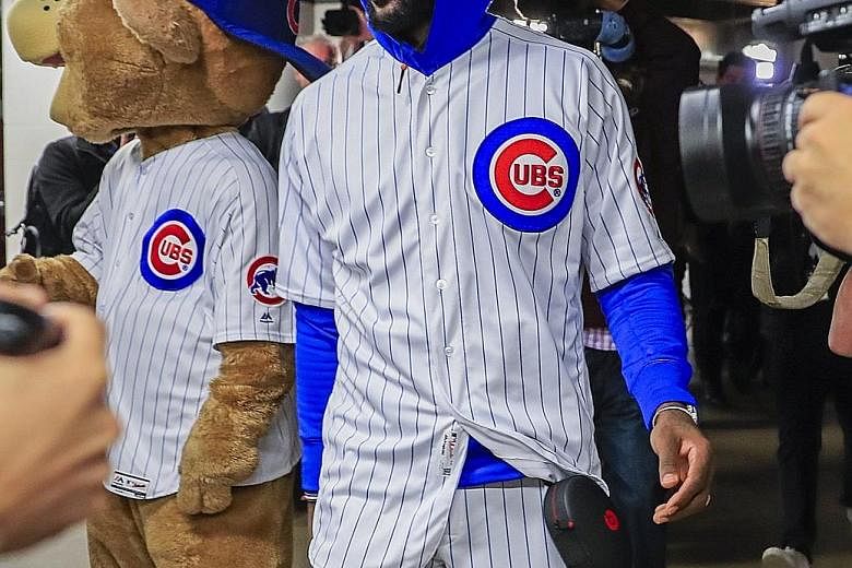 Cleveland Cavaliers forward LeBron James wearing a Chicago Cubs uniform at the United Centre before the 111-105 defeat by the Chicago Bulls on Friday. James lost a bet with former team-mate Dwyane Wade over the outcome of baseball's World Series and 
