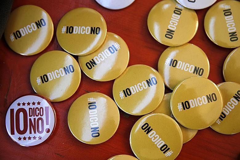 Pins with the Five Star Movement's "I Say No" message ahead of today's referendum in Italy on constitutional reforms.