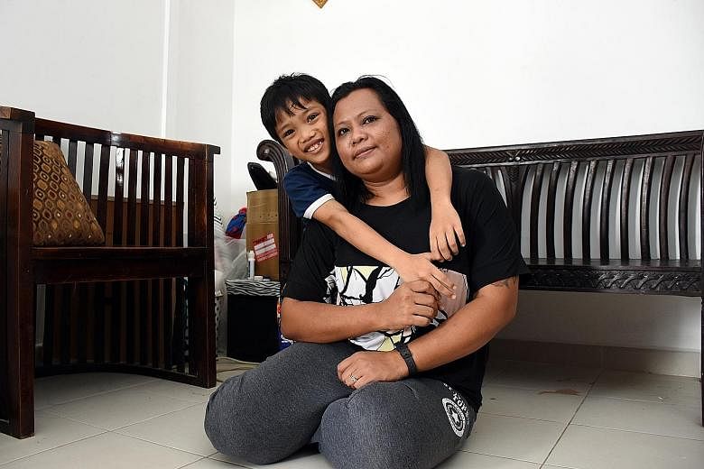 Madam Jamnah Hamzah, seen here with her son Adrian Mazuan, is keen to apply for the Fresh Start Housing Scheme to give her family a better future.