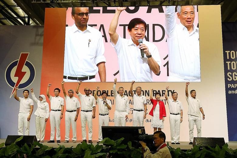 PM Lee with fellow CEC members (from left) Social and Family Development Minister Tan Chuan-Jin; Speaker of Parliament Halimah Yacob; Minister in the Prime Minister's Office Chan Chun Sing; Communications and Information Minister Yaacob Ibrahim; Depu