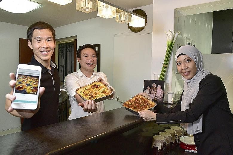 Hcook co-founders (from left) Renton Yap and Loh Kua Meng, 39, with Madam Herny Kamal, a housewife who sells food through the mobile app, which connects home cooks with hungry buyers.