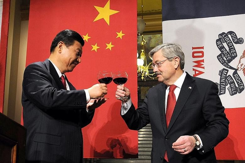 Mr Xi and Mr Branstad at a state dinner held for the Chinese leader when he visited Iowa in 2012. The two men met back in 1985, during Mr Xi's first trip to the Midwestern state, and have maintained strong bonds, thanks in part to a shared passion fo