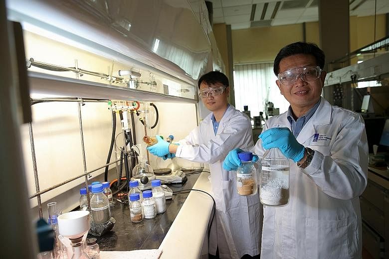 Dr Bu Jie (right) and senior research engineer Yeo Tze Yuen are among the A*Star scientists working on the new carbon dioxide conversion process. Dr Bu said: "It's one stone, two birds... We can reduce carbon dioxide from anywhere, and get constructi