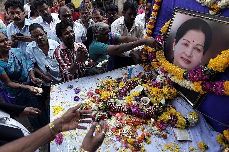 Thousands of supporters, including many in tears, paid their respects to former Tamil Nadu Chief Minister J. Jayalalithaa at her All India Anna Dravida Munnetra Kazhagam party office in Mumbai yesterday. The 68-year-old, described by her party as the