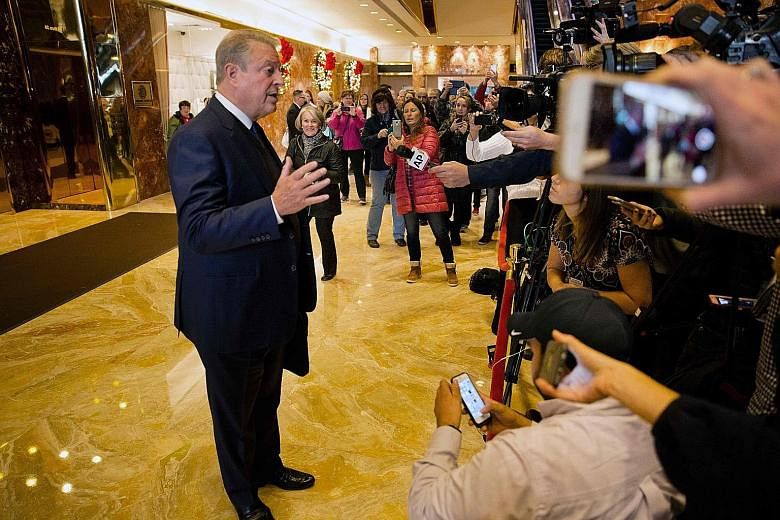 Mr Gore speaking to the media at the Trump Tower in New York City on Monday. He said he had a "lengthy and productive session" with Mr Trump.