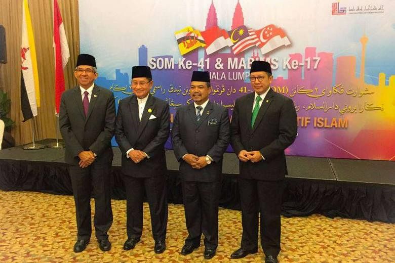 (From left) Singapore's Minister-in-charge of Muslim Affairs Yaacob Ibrahim, Brunei's Religious Minister Badaruddin Othman, Malaysia’s Minister in the Prime Minister's Office Jamil Khir Baharom and Indonesia’s Religious Minister Lukman Hakim Saifuddin at 