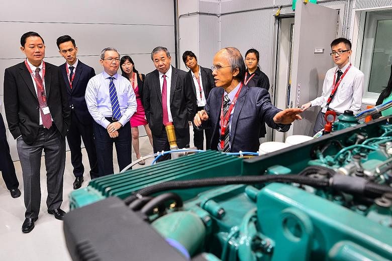 Having a tour of the Sembcorp Marine Lab are (front row, from left) Prof Louis Phee, chair of NTU's School of Mechanical and Aerospace Engineering; Sembcorp Marine president and CEO Wong Weng Sun, NTU Provost Freddy Boey, and Prof Lua Aik Chong, who 