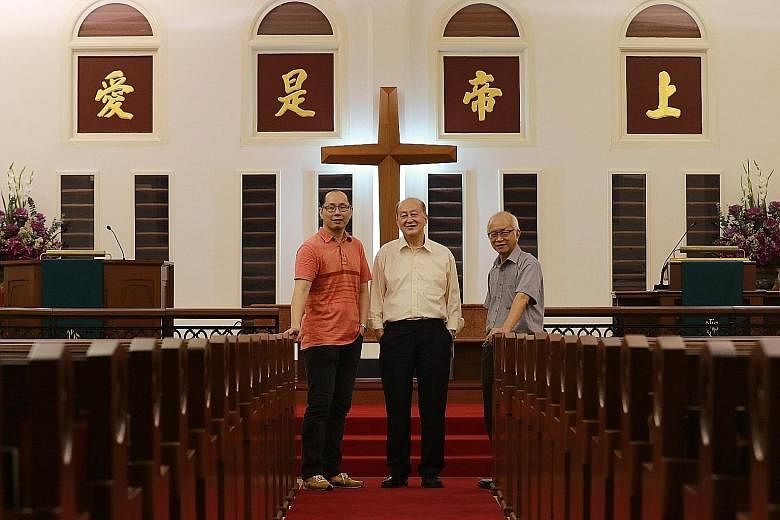 (Above, from left) Mr Winston Tay, 42, preacher and operations and admin manager; his father, Mr David Tay, former chairman of the property committee; and Mr Edward Wu, chairman of the property committee. They are in front of panels with gold-leafed 