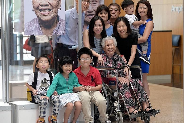 Behind Madam Tan (from left) are grandson-in-law Simon Teng, 49; granddaughter Wee Pei Sze, 36; daughter-in-law Ho Hin Tock, 64; son Wee Tai Jeok, 68; granddaughter Eveline Wee, 41; great-grandson Wee Zee Kay, three, and granddaughter-in-law Png Ying
