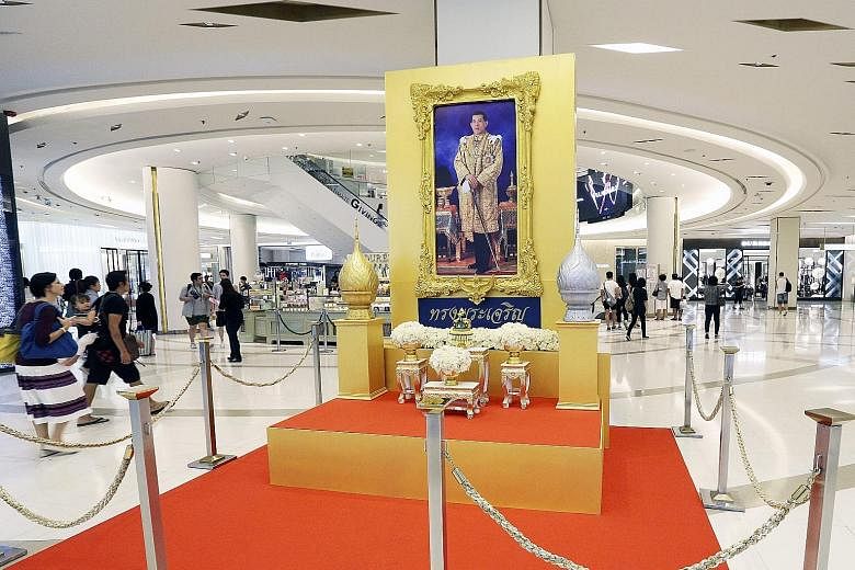 A portrait of King Maha Vajiralongkorn on display inside a shopping centre in Bangkok on Tuesday. King Maha Vajiralongkorn ascended to the throne last week.