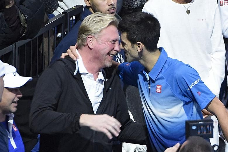 Novak Djokovic (right) hugs coach Boris Becker after winning the ATP World Tour Finals title last year. He won six Major titles in the three years he worked with the six-time Grand Slam champion.