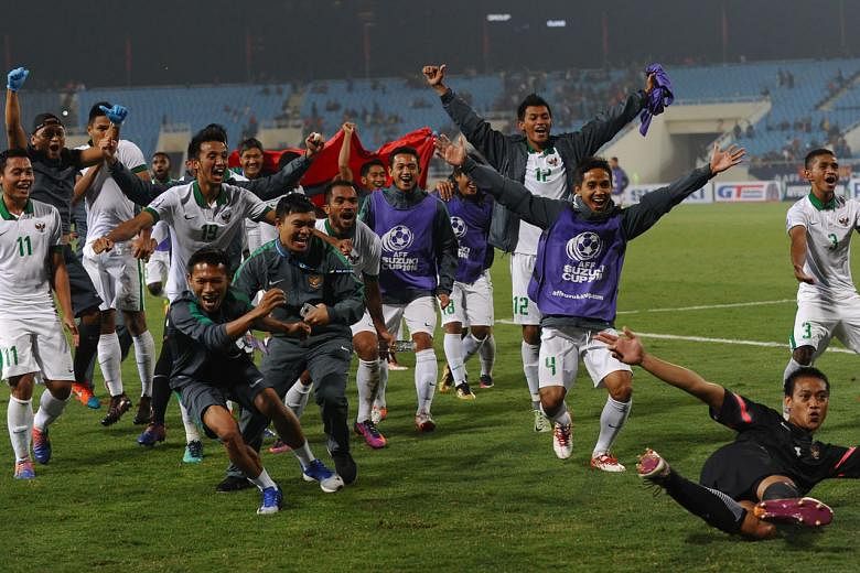 The Indonesian players celebrating after the final whistle. It took an extra-time penalty to equalise at 2-2 to put them through to the AFF Cup final 4-3 on aggregate. 