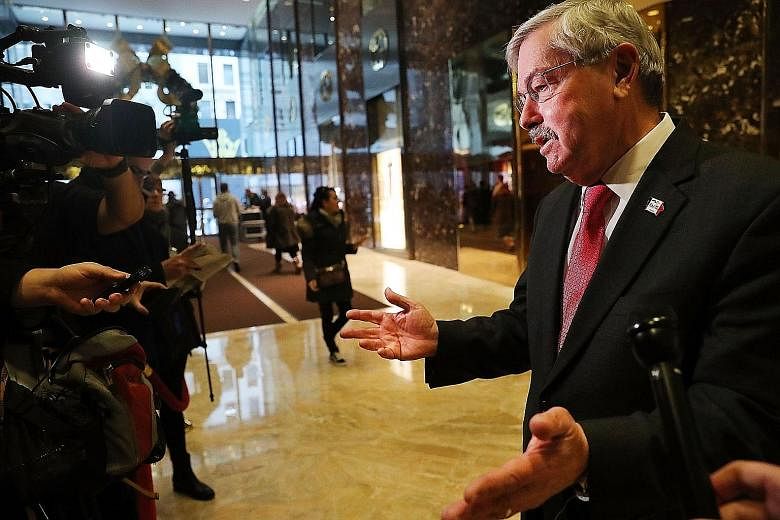 Iowa Governor Terry Branstad speaking to members of the media at Trump Tower on Tuesday in New York City. Although the Republican governor does not have any diplomatic experience, Mr Trump pointed to his long-standing ties with Mr Xi and other Chines