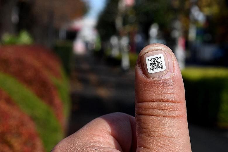 In Iruma, tiny nail stickers bearing unique ID numbers help track seniors who are prone to getting lost.