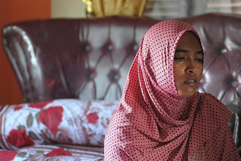 Ms Yusra Fitriani grieving in what was to be her bridal bedroom. Her fiance and seven members of his family, who had travelled to the province to attend the wedding, were killed in Wednesday's quake.