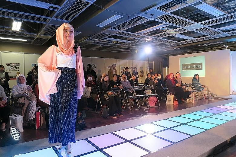A model showing a design by Singapore's Sahara Shawl during Tokyo's first "Modest Fashion Show".