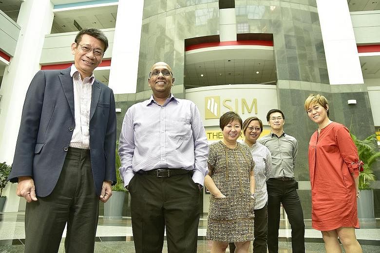 The team involved in setting up SIM's new international school includes (from left) Dr Lee, Mr Balamurugan, Ms Clare Wee, Ms Darrell Foo, Mr Kenneth Chee and Ms Wang Li-Sa. The school curriculum will focus on preparing students for the International 