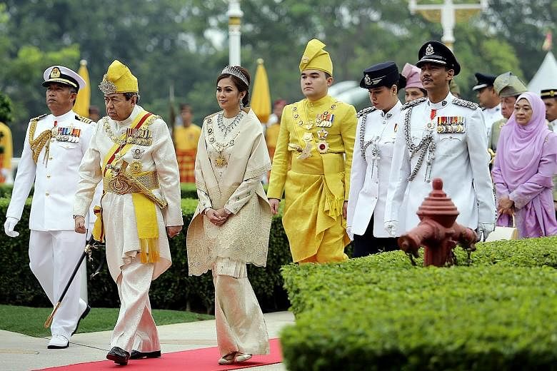 Selangor Sultan Sharafuddin Idris Shah (from second left); his consort, Tengku Permaisuri Norashikin Abdul Rahman; and his son, Tengku Amir Shah, arriving yesterday for an awards ceremony to celebrate the state ruler's 71st birthday at Istana Alam Sh