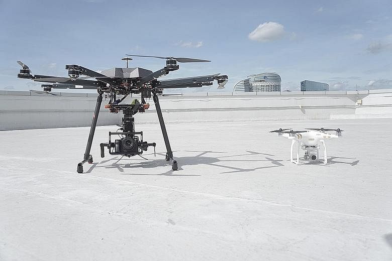 A custom-built drone from local drone operator company Avetics (left), used for industrial purposes, will weigh and cost more than a consumer drone like the DJI Phantom 3 Pro (right).