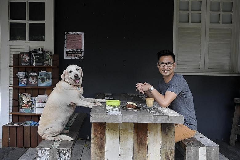 Pet Widget founder Ivan Loh and one of his two Labradors, Dawn. Once a Badge (above, right) is scanned with a smartphone, it will link to a profile on the Pet Widget platform, where you can get the owner's contact details, as well as other informatio