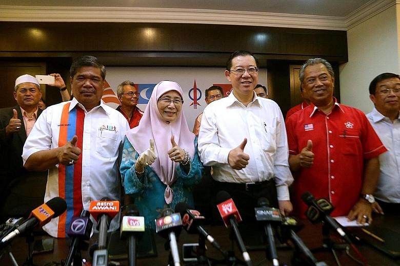 Among those at the signing ceremony yesterday were (in front row, from left) Mr Mohamad Sabu, president of Parti Amanah Negara; Dr Wan Azizah Wan Ismail, president of Parti Keadilan Rakyat; Mr Lim Guan Eng, secretary-general of Democratic Action Part