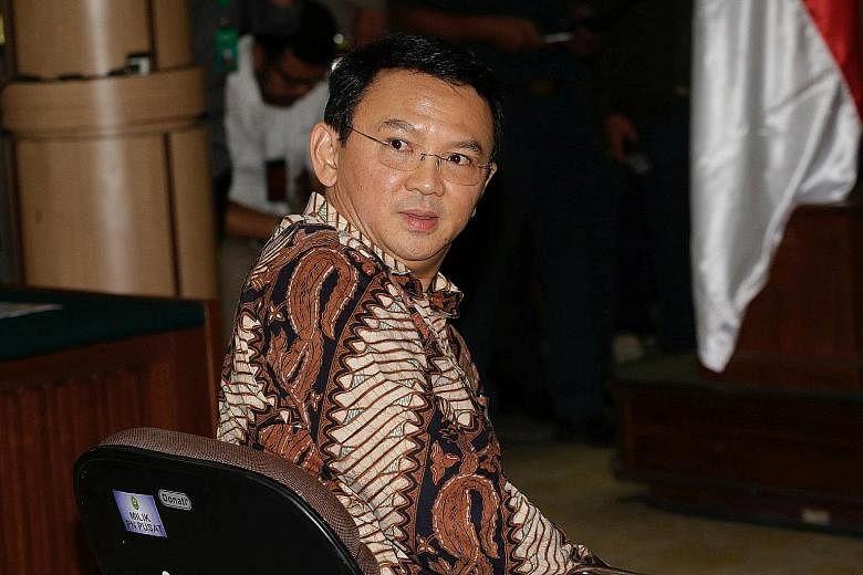 The security at the Jakarta court was tight as Governor Basuki (above) took the stand yesterday and said he had no intention of insulting Islam.