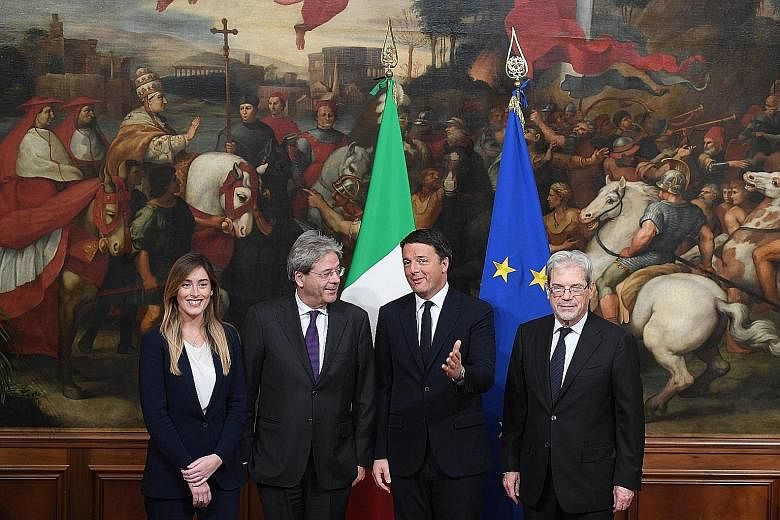 (From left) Italian Cabinet Secretary Maria Elena Boschi, Mr Gentiloni, Mr Renzi and Mr De Vincenti at the handover ceremony in Chigi Palace in Rome on Monday. Mr Gentiloni has vowed to pay particular attention to the under-developed south, which vot